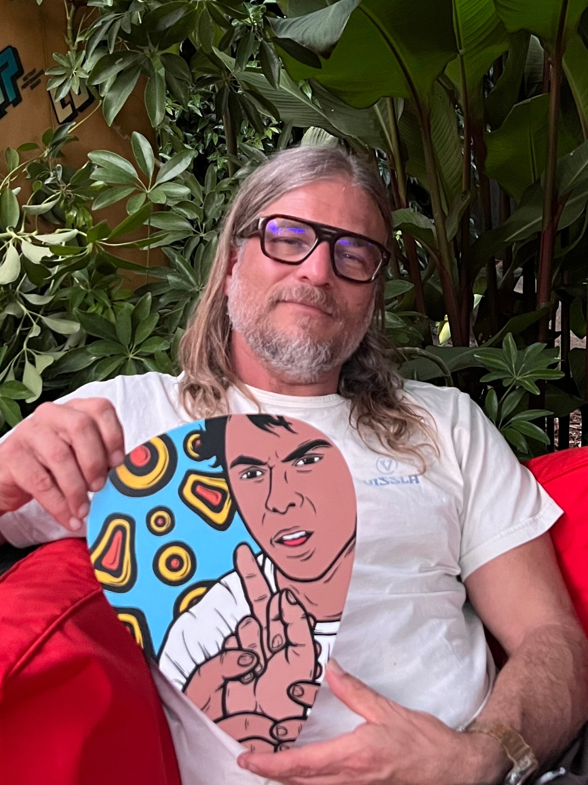 Image showing Lance Anderson holding one of his works of art